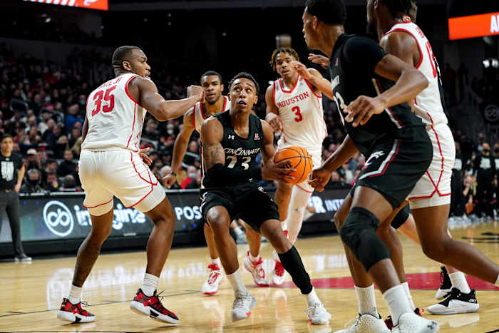 Cincinnati Bearcats guard Mika Adams-Woods (23) drives to the basket in the second half of an NCAA men s college basketball game against the Houston Cougars, Sunday, Feb. 6, 2022, at Fifth Third Arena in Cincinnati. The Houston Cougars defeated the Cincinnati Bearcats, 80-58. Houston Cougars At Cincinnati Bearcats Feb 7